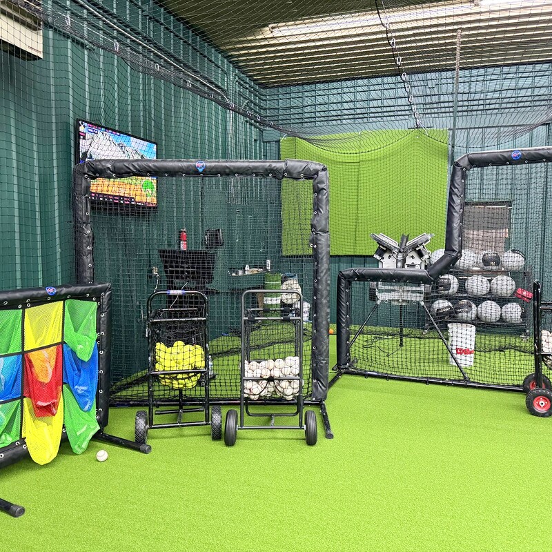 Training equipment including pitching machines and strike zone target
