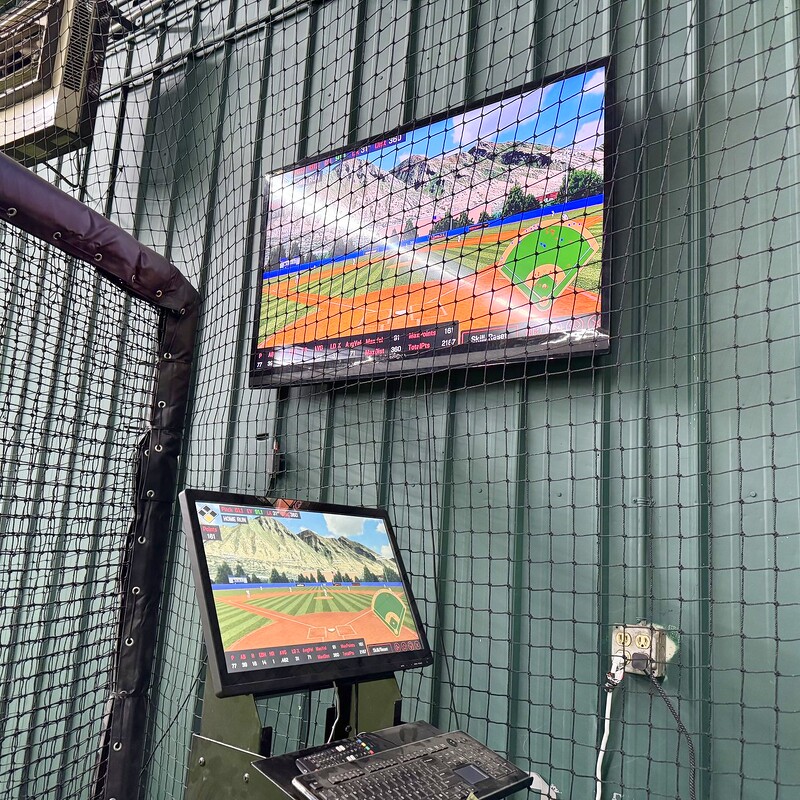 HitTrax dual-screen simulator setup
